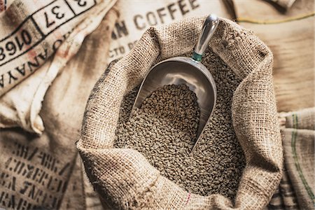 simsearch:6118-07352121,k - Full hessian sacks of beans and a metal scoop at a coffee bean processing shed, on a farm. Stock Photo - Premium Royalty-Free, Code: 6118-07352121