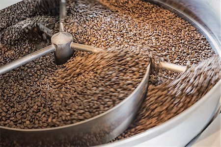 simsearch:6118-07352121,k - Machinery at a coffee bean processing shed roasting coffee beans. Stock Photo - Premium Royalty-Free, Code: 6118-07352125