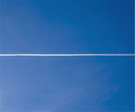 simsearch:6118-07352659,k - Jet trail across blue sky Stock Photo - Premium Royalty-Free, Code: 6118-07352248