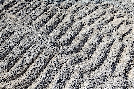 simsearch:6118-07353041,k - Gravel piles are used for road maintenance and construction purposes. Photographie de stock - Premium Libres de Droits, Code: 6118-07352251