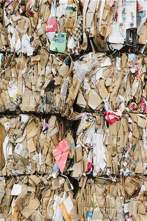 Recycling facility with bundles of cardboard sorted and tied up for recycling. Stock Photo - Premium Royalty-Free, Code: 6118-07352256