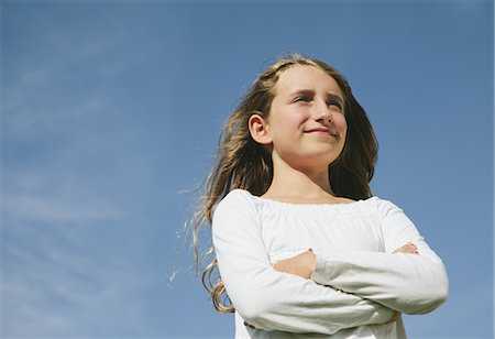 simsearch:878-07442476,k - Portrait of confident and happy nine year old girl, outdoors Stock Photo - Premium Royalty-Free, Code: 6118-07352480