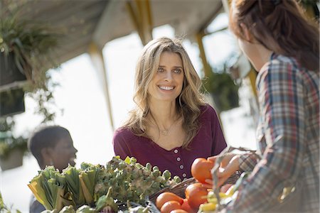 Women Working and Shopping at Organic Farm Stand Stock Photo - Premium Royalty-Free, Code: 6118-07352593