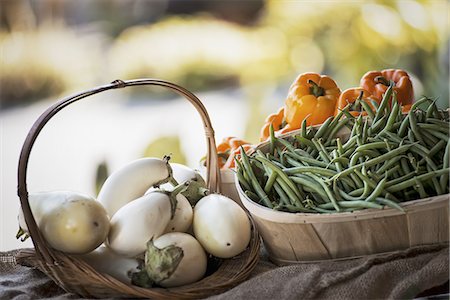 single aubergine - Organic Vegetable on Display; Organic White Eggplant; Green Beans; Yellow and Red Bell Peppers Stock Photo - Premium Royalty-Free, Code: 6118-07352909