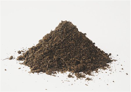 stacked - A pile of organic compost on a white background. Stock Photo - Premium Royalty-Free, Code: 6118-07353041