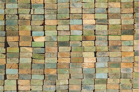 A stack of wood stud boards known as 2 x 4s. Used for construction and scaffolding. Stock Photo - Premium Royalty-Free, Code: 6118-07353275