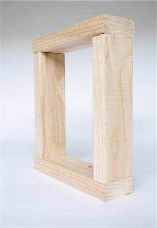 A box shape, four pieces of wood fitted together. Spruce treated  2x4 wood studs, creating a square frame. Stock Photo - Premium Royalty-Free, Code: 6118-07353285