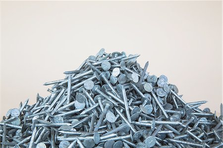 simsearch:6118-07352678,k - A heaped pile of galvanized nails. Stock Photo - Premium Royalty-Free, Code: 6118-07353295