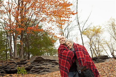 simsearch:6118-07439807,k - A couple, man and woman on a day out in autumn. Sharing a picnic rug to keep warm. Stock Photo - Premium Royalty-Free, Code: 6118-07353558