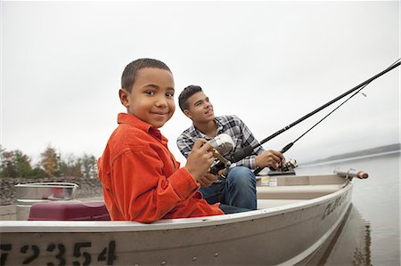 A day out at Ashokan lake. Two boys fishing from a boat. Stock Photo - Premium Royalty-Free, Code: 6118-07353562