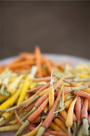 simsearch:649-06401475,k - Organic vegetables in a dish. Cooked orange, yellow and pink heritage baby carrots. Farmstand produce. Stock Photo - Premium Royalty-Free, Code: 6118-07354055