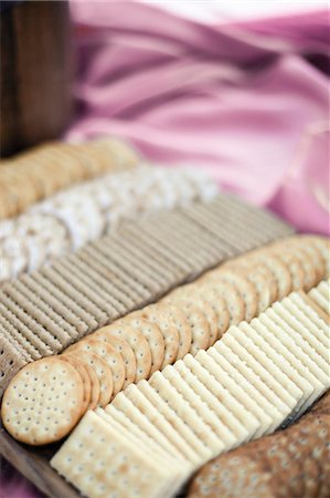 pictures of pink wafer biscuits - A tray of cheese crackers and biscuits laid out. A choice of shapes and flavours. Stock Photo - Premium Royalty-Free, Code: 6118-07354127
