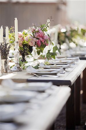 pictures at a wedding - A formal wedding breakfast table, laid for a feast. Fresh flowers in the centre. Stock Photo - Premium Royalty-Free, Code: 6118-07354128