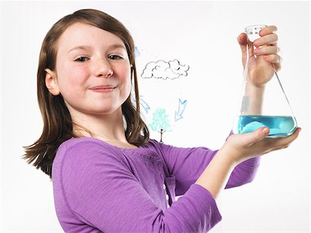 A young girl holding a conical flask of blue liquid in front of an evaporation cycle illustration on a clear surface. Photographie de stock - Premium Libres de Droits, Code: 6118-07354250