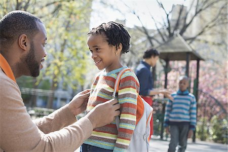 family african americans - A New York city park in the spring. A family, parents and two boys spending time together. Stock Photo - Premium Royalty-Free, Code: 6118-07354664