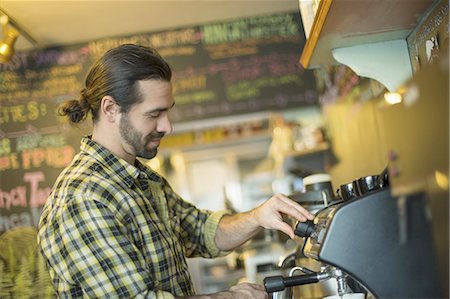 A coffee shop and cafe in High Falls called The Last Bite. A man making coffee. Stock Photo - Premium Royalty-Free, Code: 6118-07440345