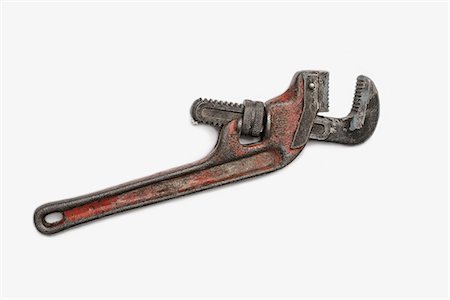 Used Tools. A worn and well used mole wrench or adjustable spanner. Stock Photo - Premium Royalty-Free, Code: 6118-07440391