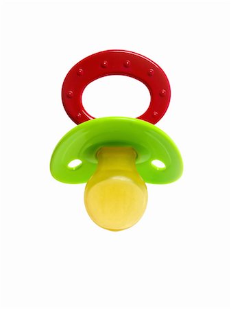 soother - A coloured plastic baby pacifier, dummy or soother. Stock Photo - Premium Royalty-Free, Code: 6118-07440591