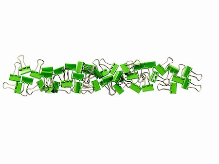 environmental conservation - Green Office Supplies. Paperclips on a white background. Stock Photo - Premium Royalty-Free, Code: 6118-07440751
