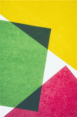 paper material - Pieces of colourful, recycled construction paper, overlapping and laid out at random. Photographie de stock - Premium Libres de Droits, Code: 6118-07440704