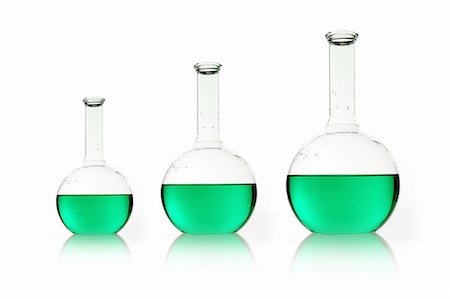 simsearch:670-03734300,k - Three rounded shaped scientific chemical flasks holding green liquid, arranged in size order. Foto de stock - Sin royalties Premium, Código: 6118-07440735