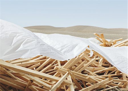 simsearch:6118-07352690,k - White tarp covering pile of wood 2x4 studs, farmland in background, near Pullman Stock Photo - Premium Royalty-Free, Code: 6118-07440916