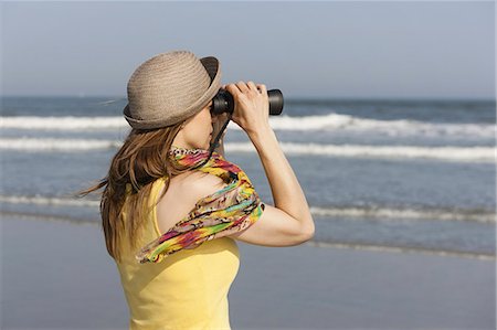 summer in new jersey beach - A woman in a sunhat and scarf on the beach on the New Jersey Shore, at Ocean City. Stock Photo - Premium Royalty-Free, Code: 6118-07521788