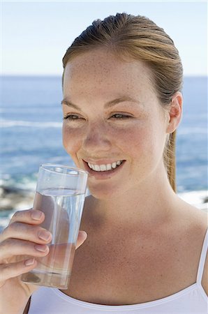 drinking glass of water - A spa treatment centre. A young woman drinking a glass of water. Stock Photo - Premium Royalty-Free, Code: 6118-07521811