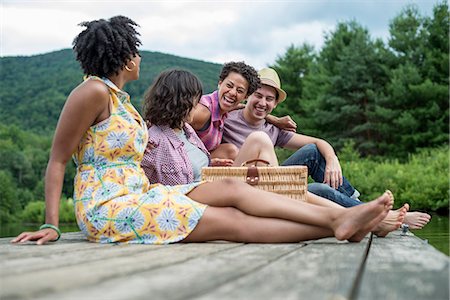 simsearch:6118-08488428,k - A group of people sitting on a woode pier overlooking a lake. Stock Photo - Premium Royalty-Free, Code: 6118-07781744