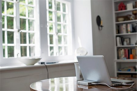 router - Laptop on a table in a home office. Stock Photo - Premium Royalty-Free, Code: 6118-07781780