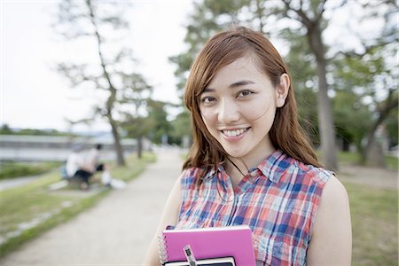 simsearch:6118-07813281,k - Young woman in the park. Stock Photo - Premium Royalty-Free, Code: 6118-07813262