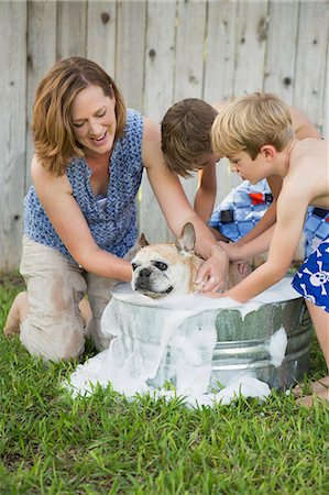 dog standing on person - Austin, Texas, USA Stock Photo - Premium Royalty-Free, Code: 6118-07913337