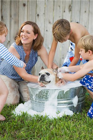 dog standing on person - Austin, Texas, USA Stock Photo - Premium Royalty-Free, Code: 6118-07913338