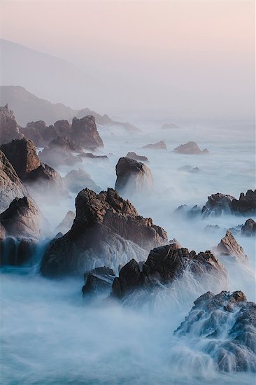 The Pacific Ocean coastline, with waves crashing against the shore. Stock Photo - Premium Royalty-Free, Image code: 6118-08001545