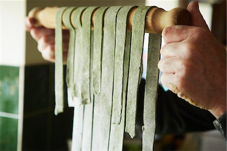 single person preparing food not chef - A man making fresh pasta with nettles and foraged plants. Stock Photo - Premium Royalty-Free, Code: 6118-08023760