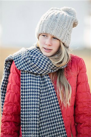 simsearch:6118-08023790,k - A girl in a red jacket with a large checked woollen scarf. Stock Photo - Premium Royalty-Free, Code: 6118-08023787