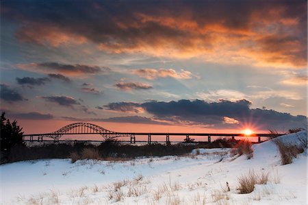 simsearch:6118-09144991,k - Winter sunset over the Robert Moses Causeway in New York. Stock Photo - Premium Royalty-Free, Code: 6118-08140141