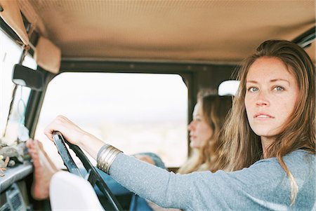 Two women on an outing in the desert, in a 4x4. Stock Photo - Premium Royalty-Free, Code: 6118-08140176