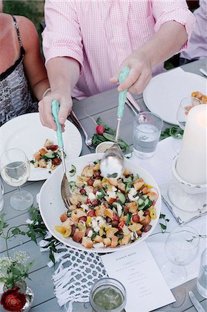 salad tongs - People around a table at a garden party, a bowl of salad. Stock Photo - Premium Royalty-Free, Code: 6118-08282235