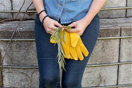 simsearch:6118-08220584,k - Young woman on a working farm, taking a break in the shade of a silo. Stock Photo - Premium Royalty-Free, Code: 6118-08220572