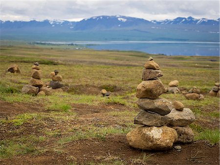 Several small stone cairns, made by balancing rocks in a pile. Stock Photo - Premium Royalty-Free, Code: 6118-08226998