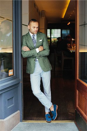 startup business - Portrait of the chef sommelier standing at the door of a city restaurant. Stock Photo - Premium Royalty-Free, Code: 6118-08226904