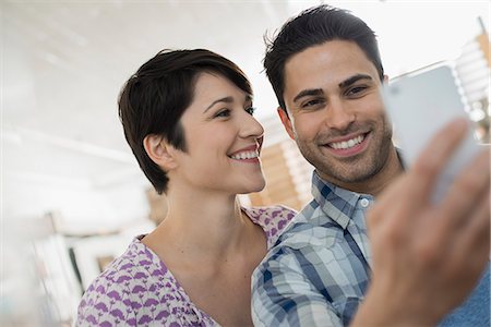 simsearch:6118-07781777,k - A couple, man and woman posing for a selfy. Stock Photo - Premium Royalty-Free, Code: 6118-08394054