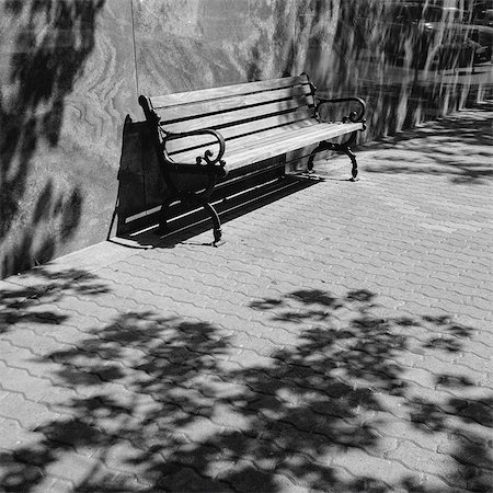 empty street wall - A bench on a downtown sidewalk in a town. Stock Photo - Premium Royalty-Free, Code: 6118-08399625