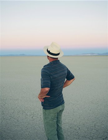 Middle aged man at dawn in the Black Rock Desert, Nevada Stockbilder - Premium RF Lizenzfrei, Bildnummer: 6118-08313759