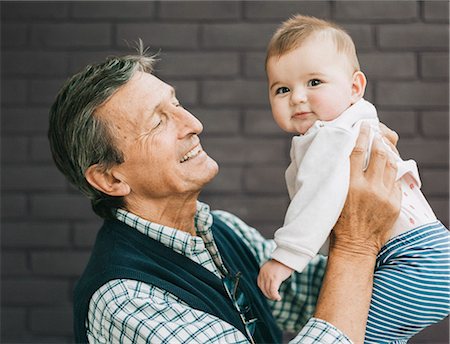 A grandfather and baby granddaughter. Stock Photo - Premium Royalty-Free, Code: 6118-08313833