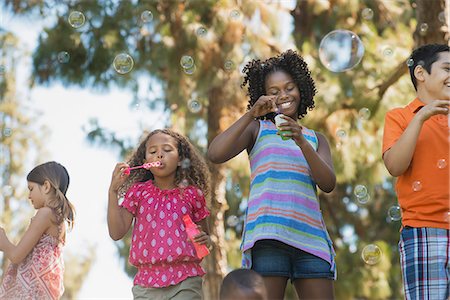 simsearch:6118-07966899,k - Children playing outdoors in summer Stock Photo - Premium Royalty-Free, Code: 6118-08488321