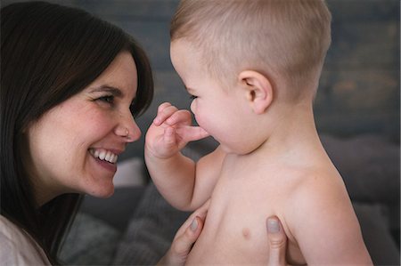 simsearch:6118-08659784,k - A woman playing with her young son. Foto de stock - Royalty Free Premium, Número: 6118-08659785