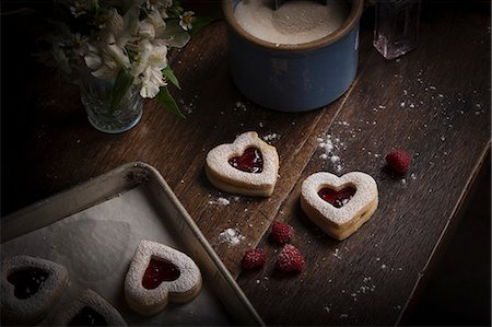 simsearch:6118-08660146,k - Valentine's Day baking, high angle view of a baking tray with heart shaped biscuits. Stock Photo - Premium Royalty-Free, Code: 6118-08660148