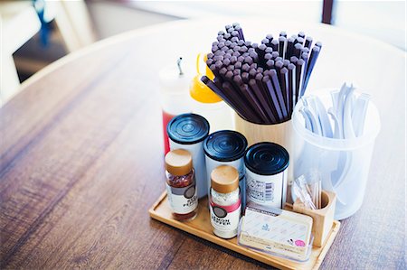 fast food city - A ramen noodle shop counter with chopsticks and condiments. Stock Photo - Premium Royalty-Free, Code: 6118-08761698